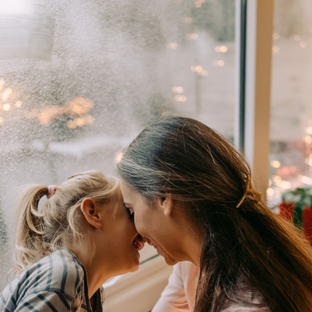 mom and daughter laughing