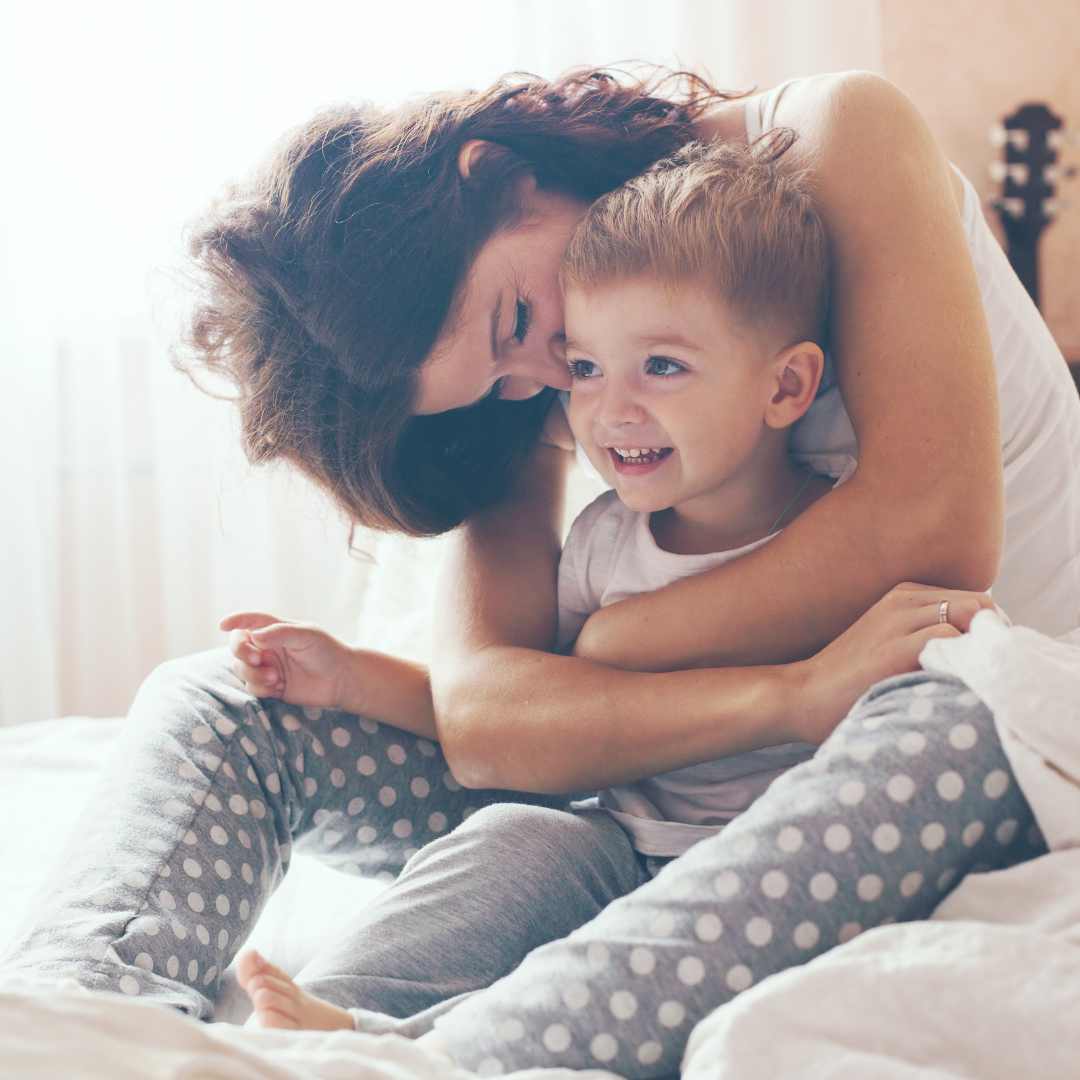 Mom with son hugging