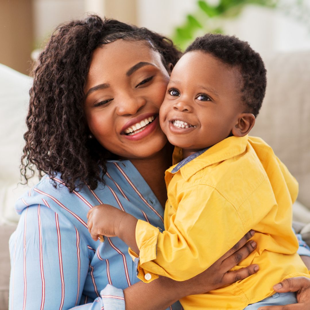 mom hugging her son