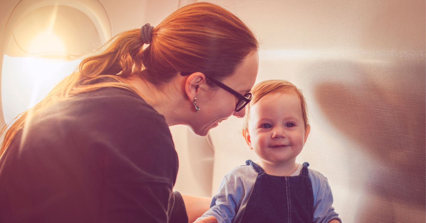 picture of a mom and a toddler on a plane
