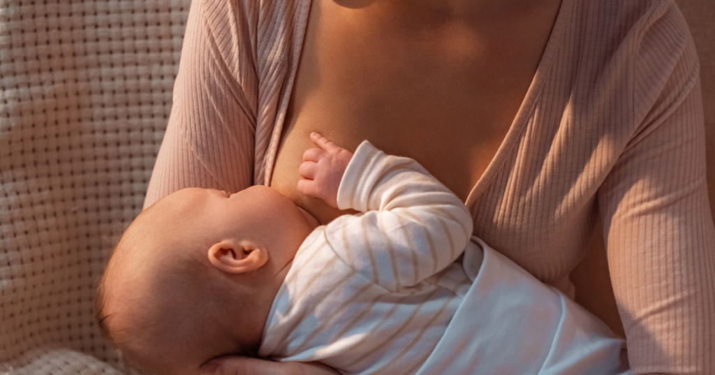 mom nursing a baby virtual lactation consulting | bella luna family