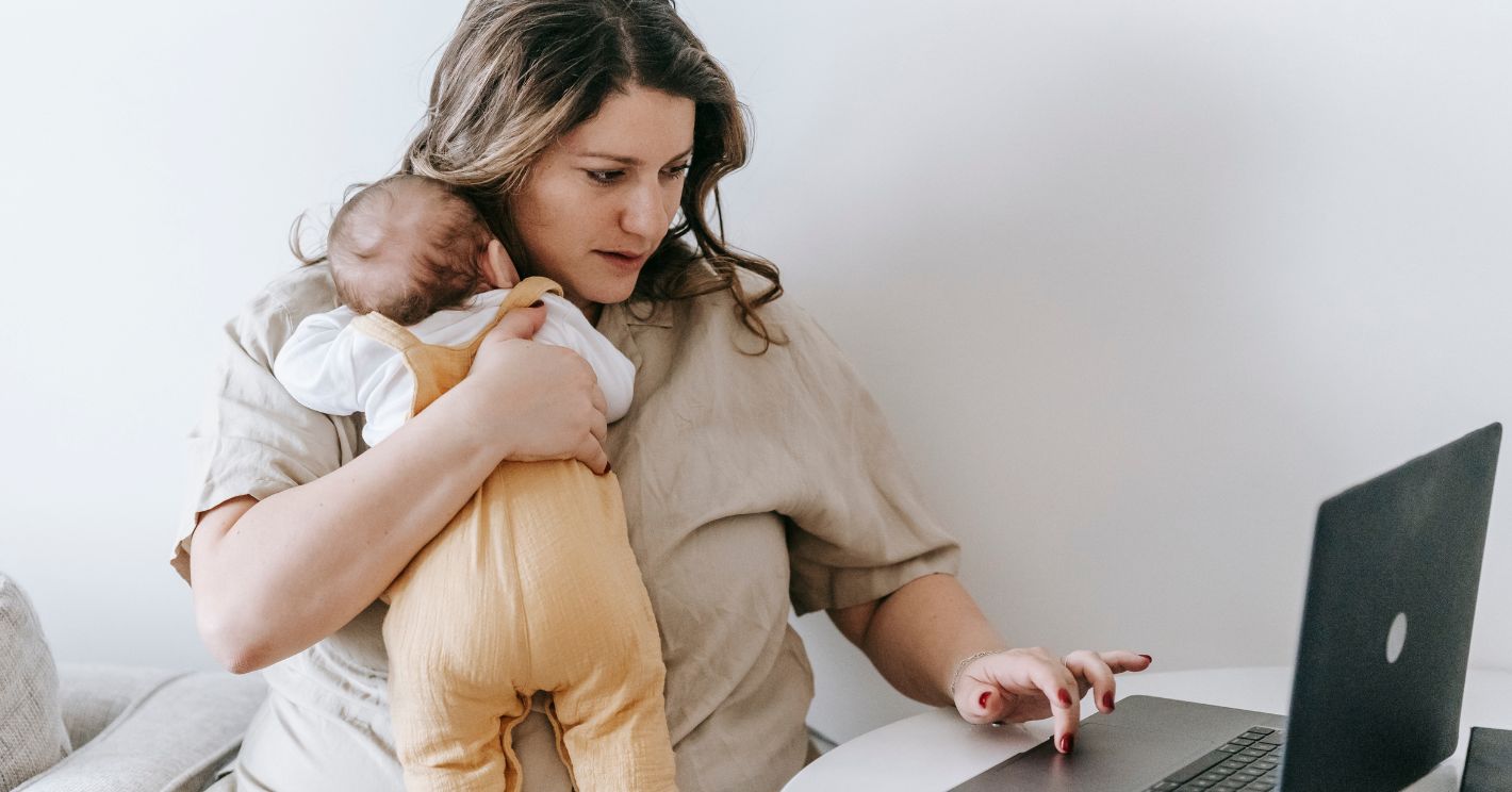 mom with newborn shopping on her laptop for amazon prime day deals