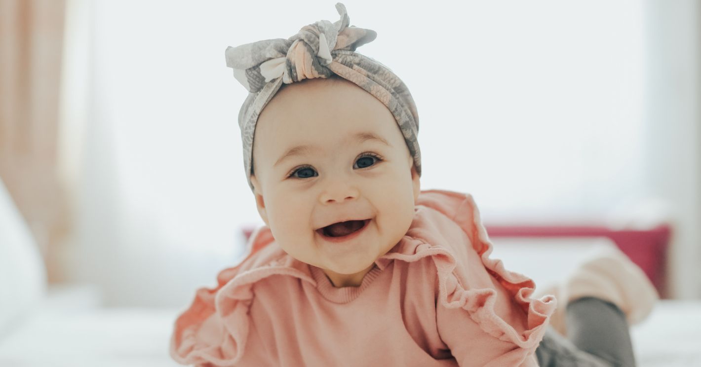 picture of a baby girl doing tummy time